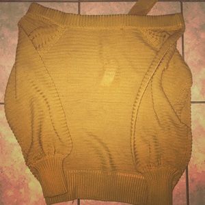 A goldish yellow sweater